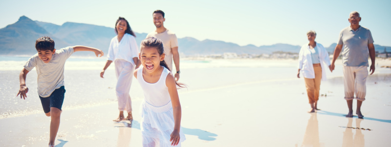 A family enjoying their time together along the seashore.